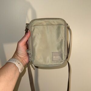 Lululemon crossbody bag, barely used. Color is a taupe with a slight green tint